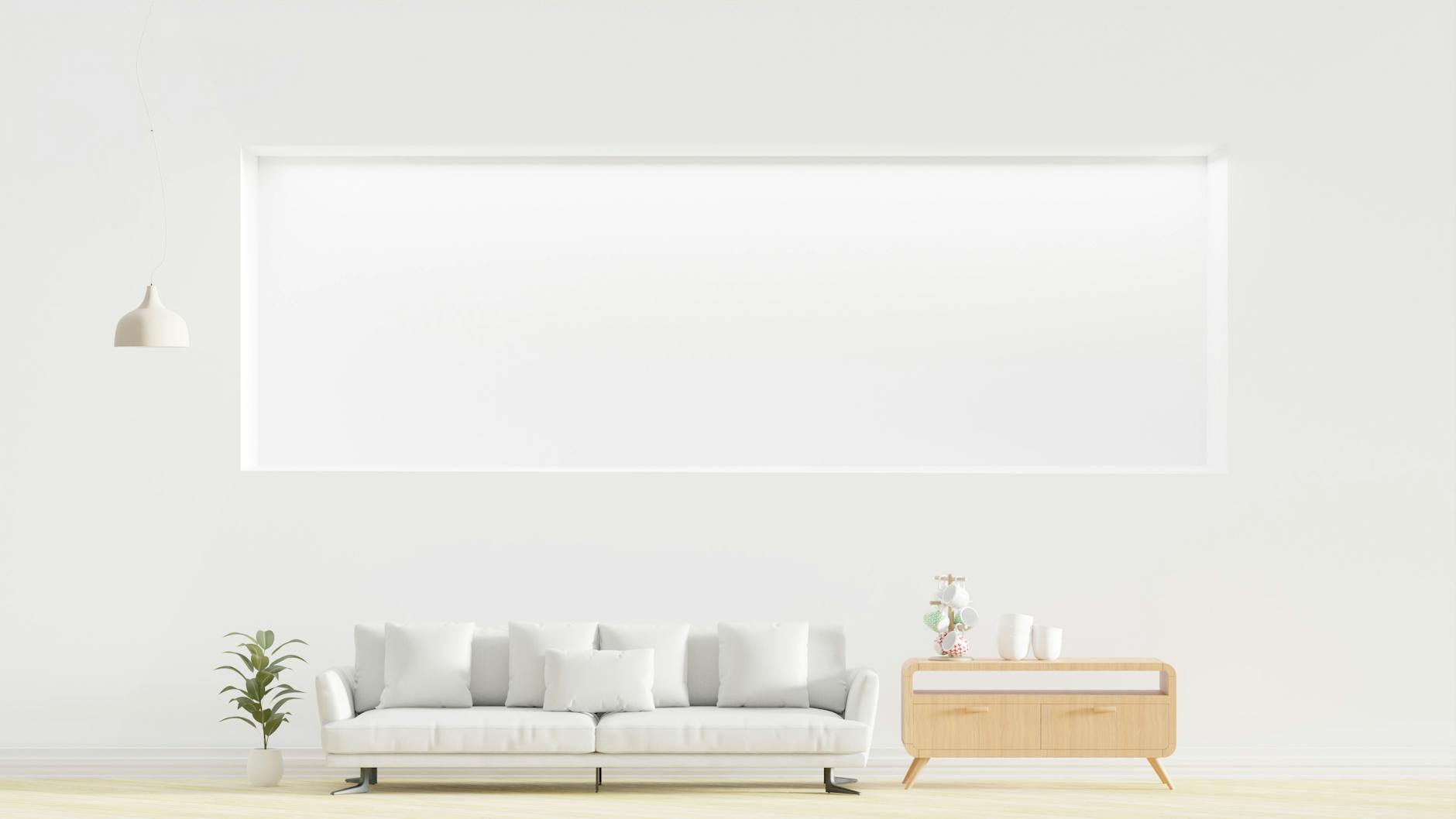 Jasny, minimalistyczny salon z kanapą, komodą i rośliną w doniczce